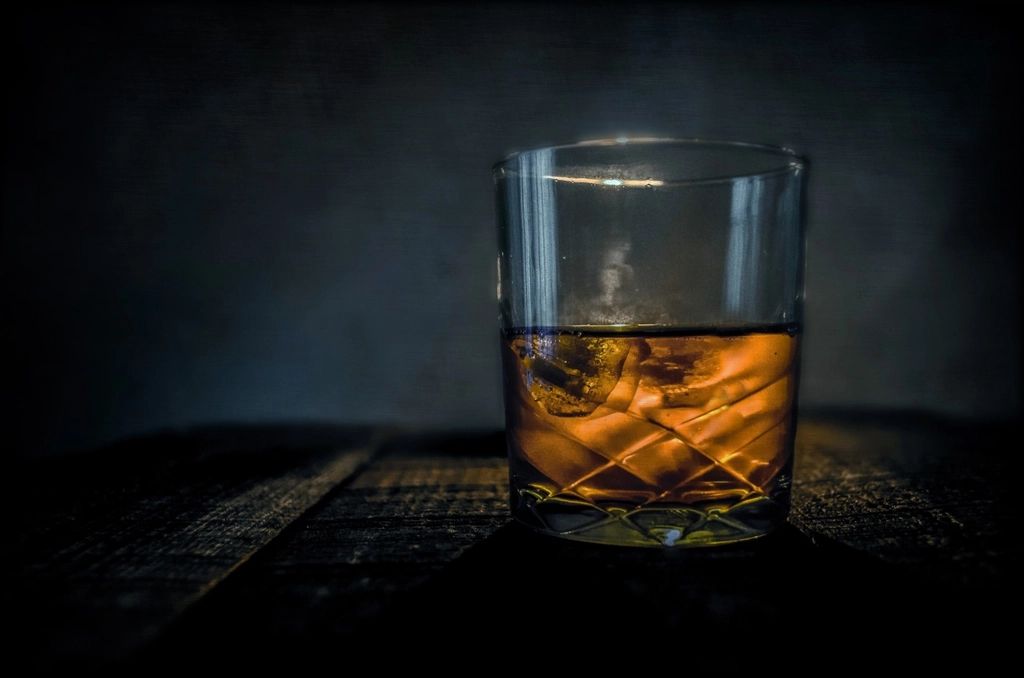 A cocktail being finished at the bar