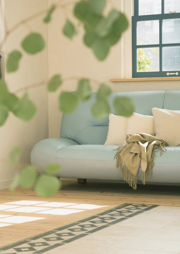 A suite sitting room with a sofa and armchairs