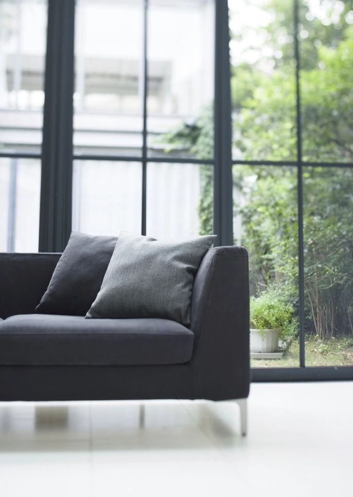 A suite sitting room with a sofa and armchairs